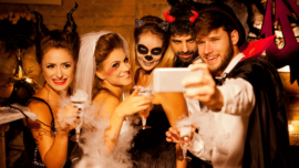 young adults in Halloween costumes taking selfie